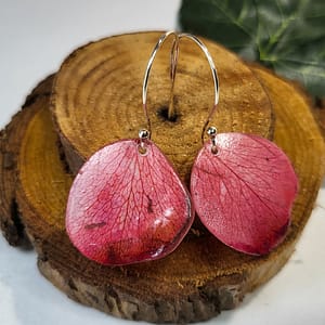 Love is a Rose Petal Earrings Overhead on Wood Close Up